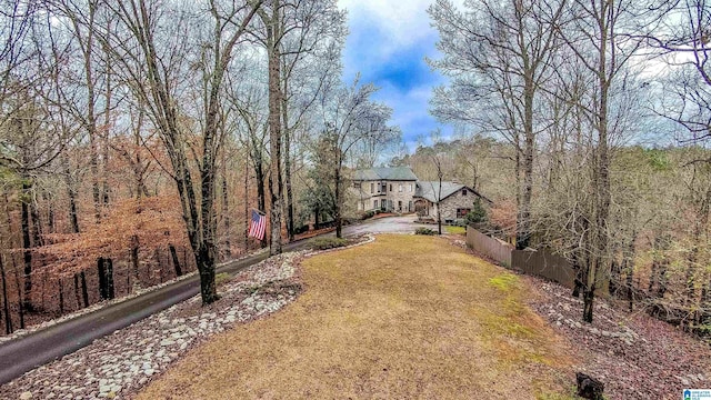 view of front of house featuring a front yard and fence