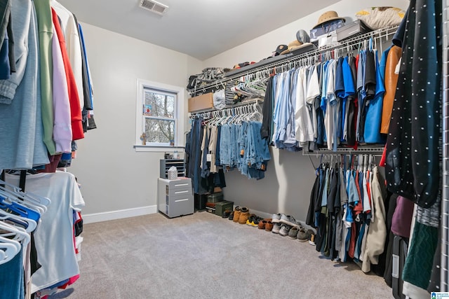 spacious closet with carpet flooring and visible vents