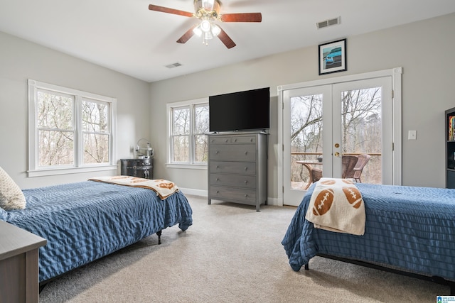 bedroom featuring access to exterior, visible vents, light colored carpet, and french doors