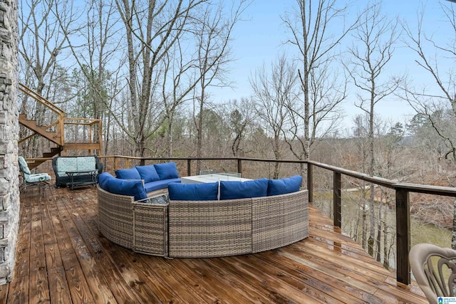 wooden deck with an outdoor living space