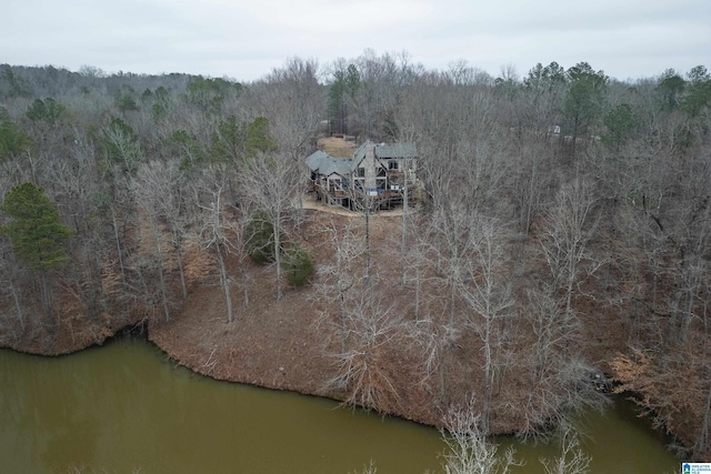 drone / aerial view with a water view and a wooded view