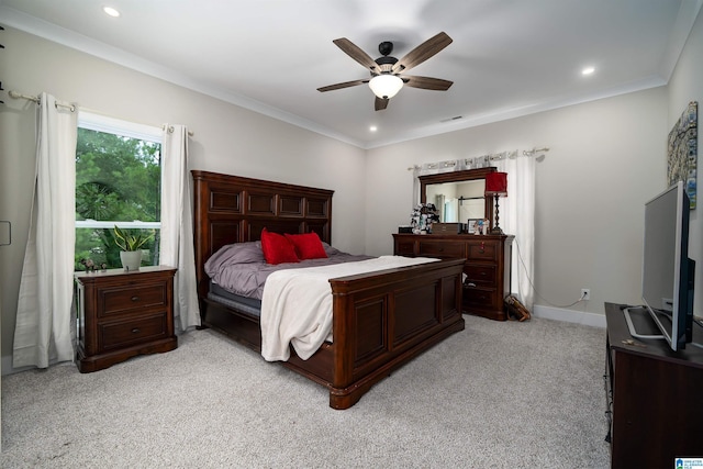 carpeted bedroom with crown molding and ceiling fan