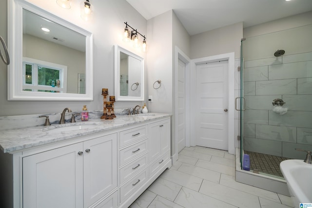 bathroom featuring vanity and independent shower and bath