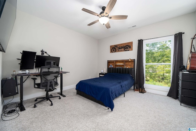 carpeted bedroom featuring ceiling fan