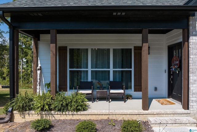 view of exterior entry featuring a porch