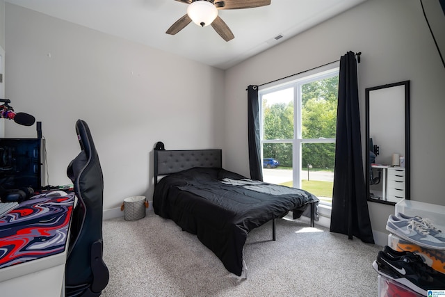 carpeted bedroom featuring ceiling fan