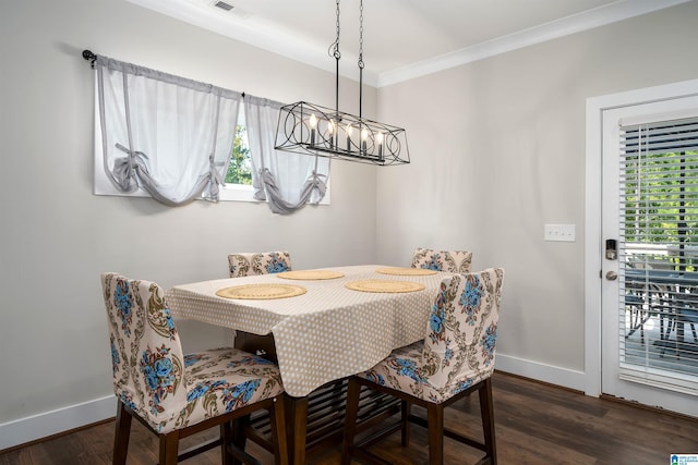 dining space featuring crown molding and dark hardwood / wood-style floors