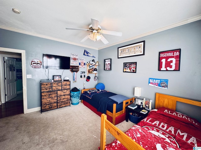 carpeted bedroom with ceiling fan and ornamental molding