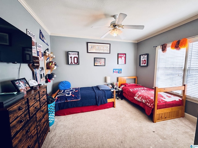 carpeted bedroom featuring a textured ceiling, ceiling fan, and ornamental molding