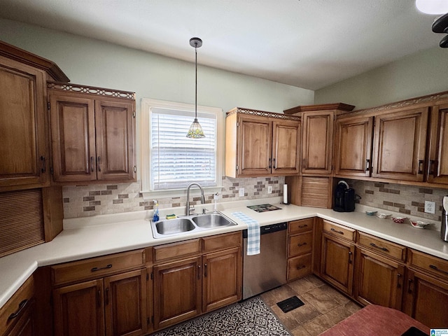 kitchen featuring sink, stainless steel dishwasher, decorative backsplash, and decorative light fixtures