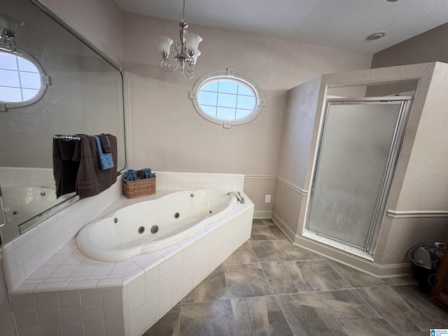 bathroom featuring an inviting chandelier and plus walk in shower