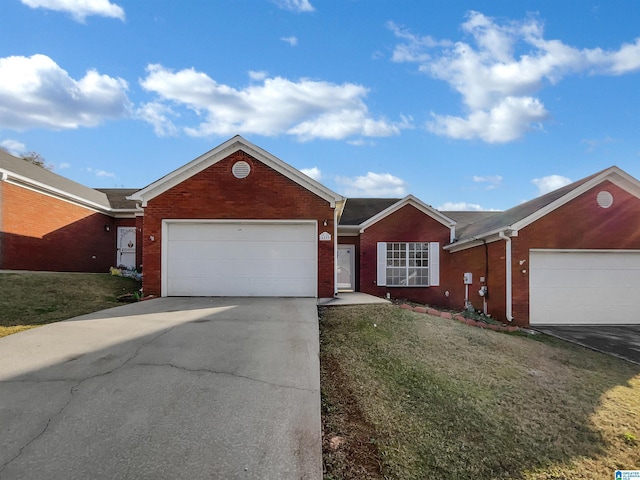 ranch-style home with a garage and a front yard