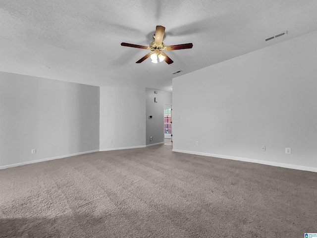 unfurnished room featuring ceiling fan, carpet flooring, and a textured ceiling