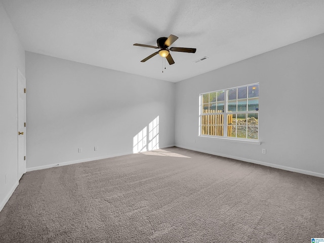 carpeted empty room with ceiling fan