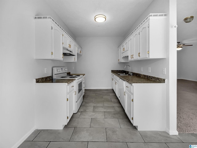 kitchen with white cabinetry, white range with electric cooktop, ceiling fan, and light tile patterned floors