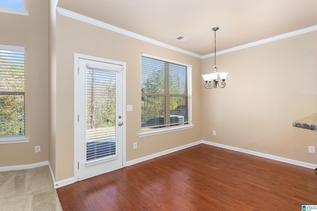 interior space with crown molding, an inviting chandelier, and dark wood-type flooring