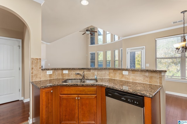 kitchen featuring dishwasher, sink, decorative backsplash, light stone counters, and dark wood-type flooring