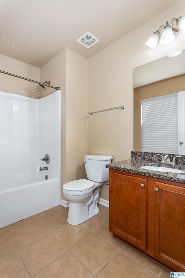 full bathroom featuring tile patterned flooring, vanity, washtub / shower combination, and toilet