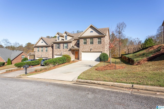 view of front of property featuring a garage and a front lawn