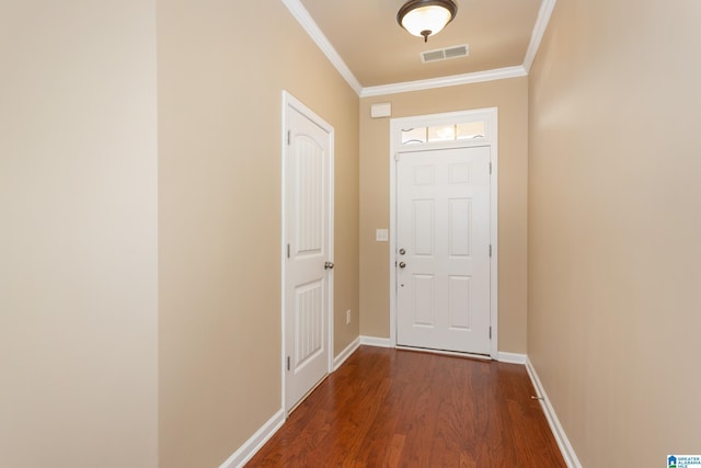 entryway with dark hardwood / wood-style flooring and ornamental molding