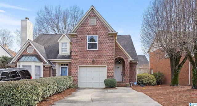 tudor house featuring a garage