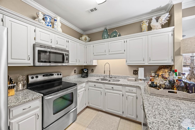 kitchen with sink, white cabinetry, crown molding, appliances with stainless steel finishes, and light stone countertops