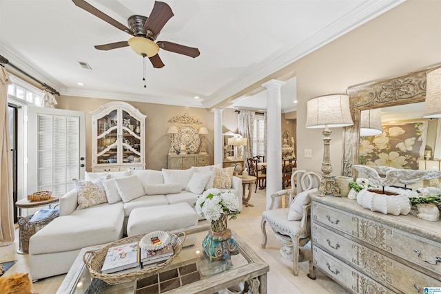 living room featuring crown molding, ceiling fan, decorative columns, and a wealth of natural light