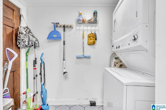 laundry room featuring stacked washer and clothes dryer and laundry area