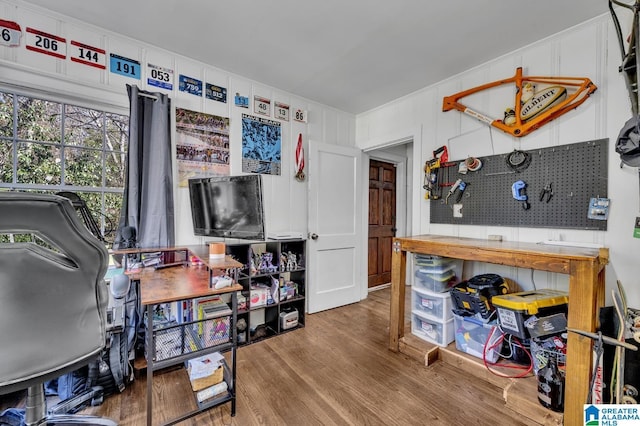 interior space featuring a workshop area and wood finished floors