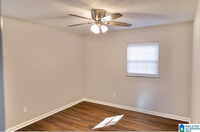 unfurnished room featuring dark hardwood / wood-style flooring, ceiling fan, and a textured ceiling