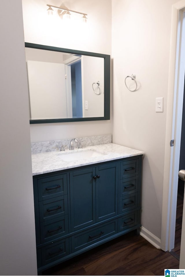 bathroom featuring vanity and wood-type flooring