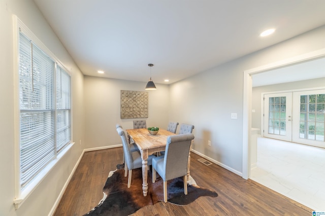 dining area featuring dark wood-type flooring and french doors