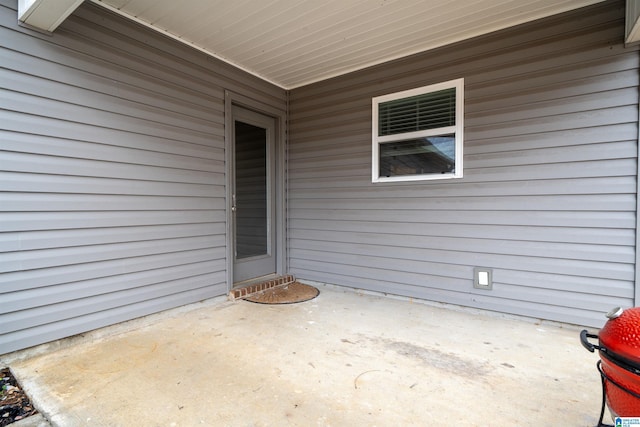 doorway to property featuring a patio