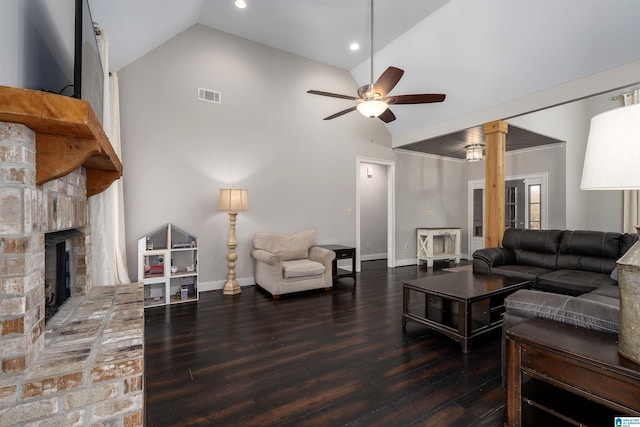 living room with a fireplace, dark wood-type flooring, high vaulted ceiling, and ceiling fan