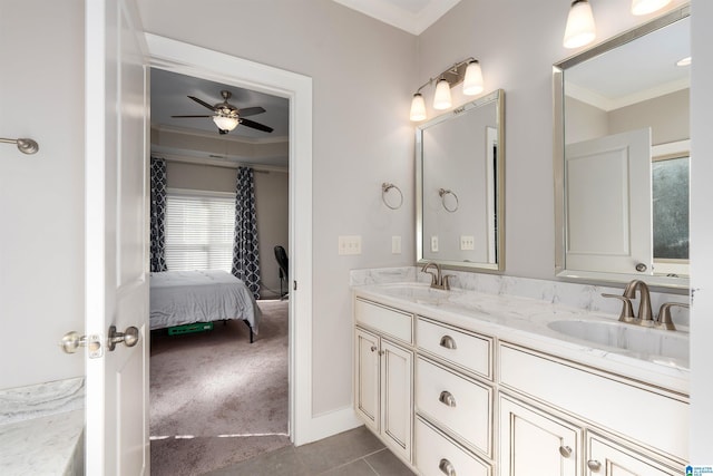 bathroom with tile patterned flooring, ceiling fan, vanity, and crown molding