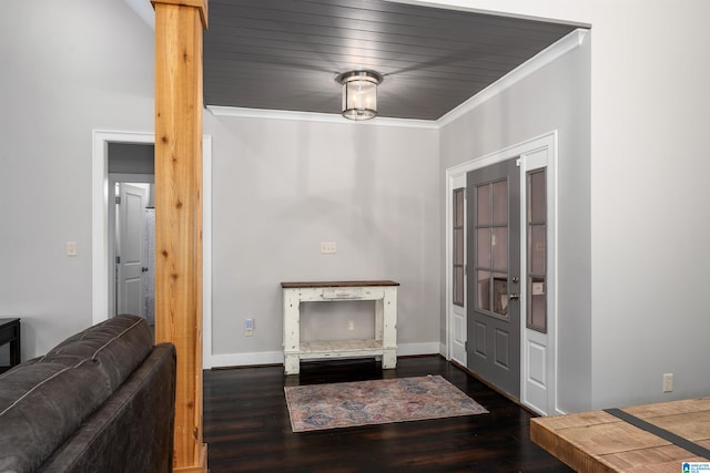 foyer entrance with dark wood-type flooring and crown molding