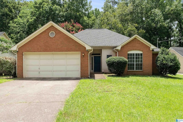 single story home featuring a garage and a front lawn