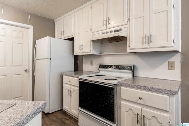 kitchen featuring white cabinets, white appliances, dark wood-type flooring, and a textured ceiling