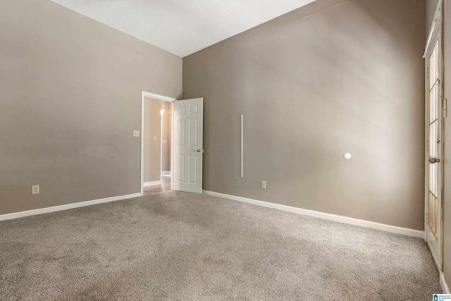 unfurnished room featuring carpet flooring