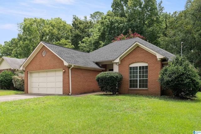 view of front of house featuring a garage and a front yard