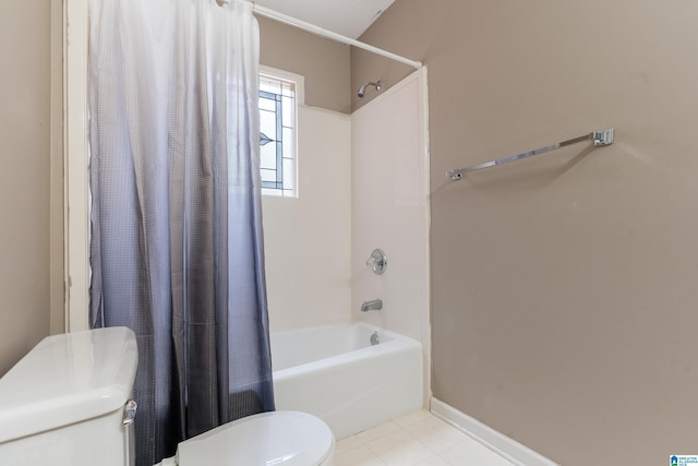 bathroom with shower / bathtub combination with curtain, tile patterned floors, and toilet