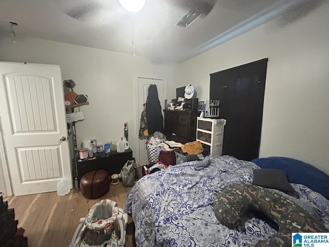 bedroom with hardwood / wood-style floors