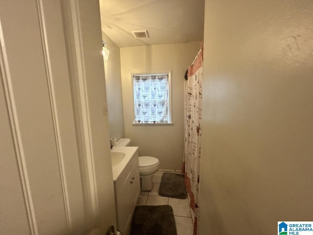 bathroom with tile patterned floors, toilet, and vanity