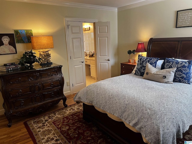 bedroom featuring ornamental molding and wood finished floors