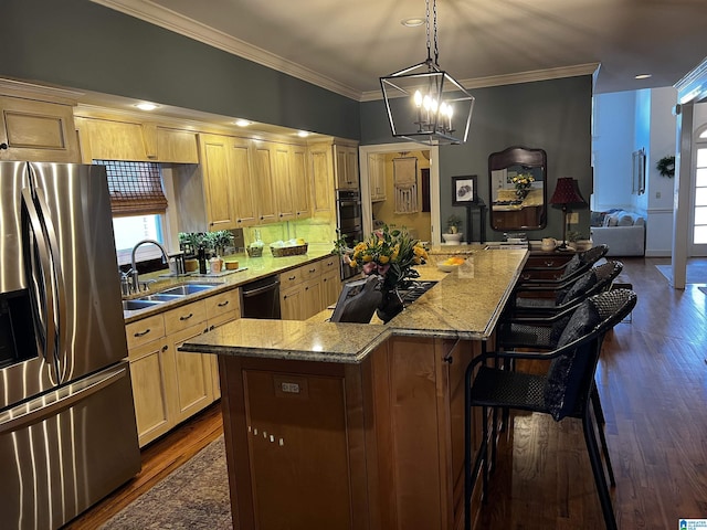 kitchen with light brown cabinets, a sink, a large island, and stainless steel fridge with ice dispenser