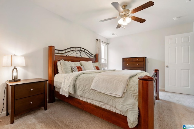 bedroom featuring ceiling fan and light carpet