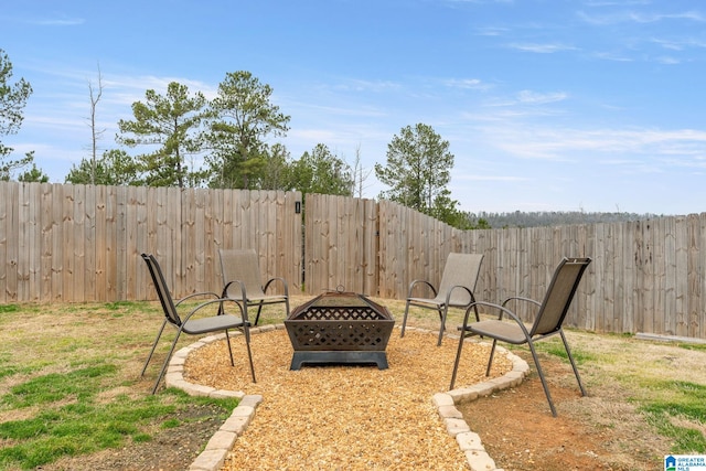 view of yard featuring an outdoor fire pit