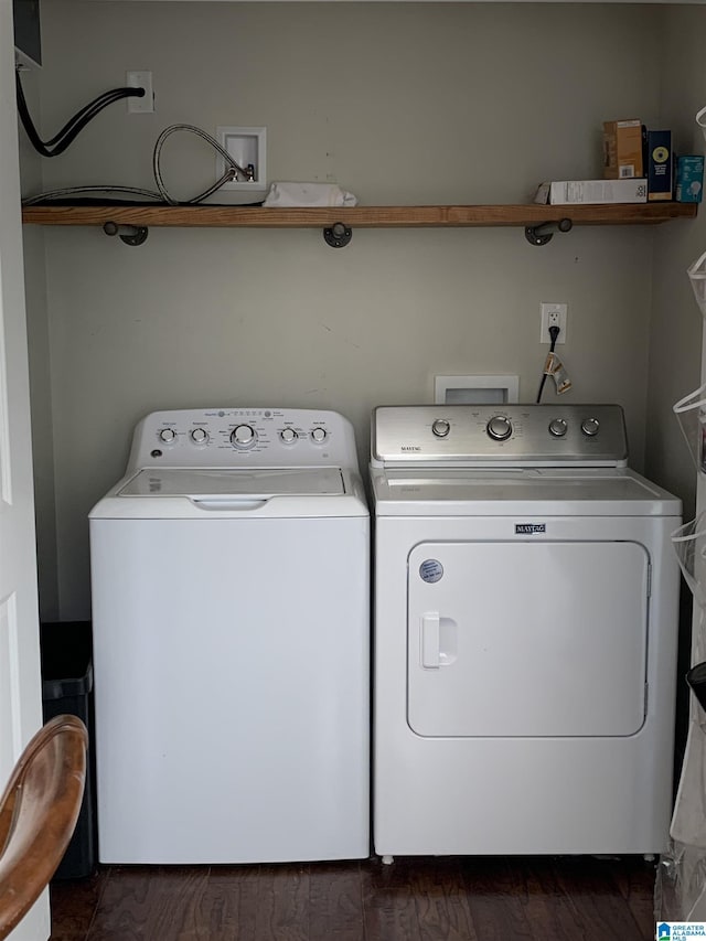 clothes washing area featuring washer and dryer and laundry area