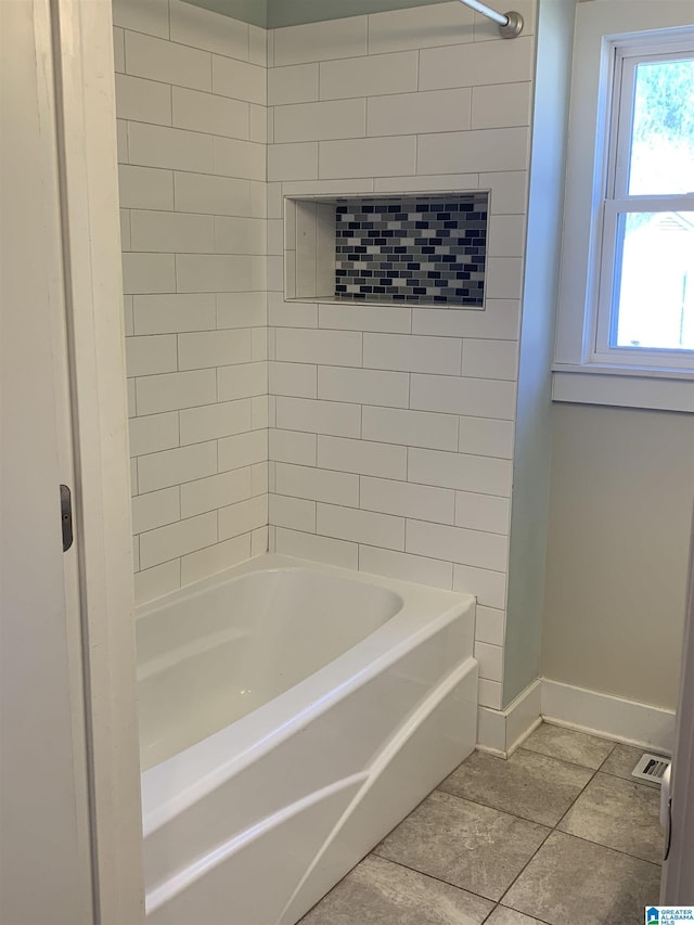 full bathroom with tile patterned flooring, shower / bath combination, visible vents, and baseboards