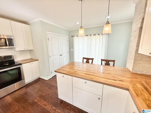 kitchen featuring butcher block counters, ornamental molding, dark wood-style flooring, stainless steel appliances, and backsplash